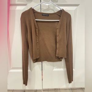a button up brown brandy melville cardigan that can also be worn as a sweater.